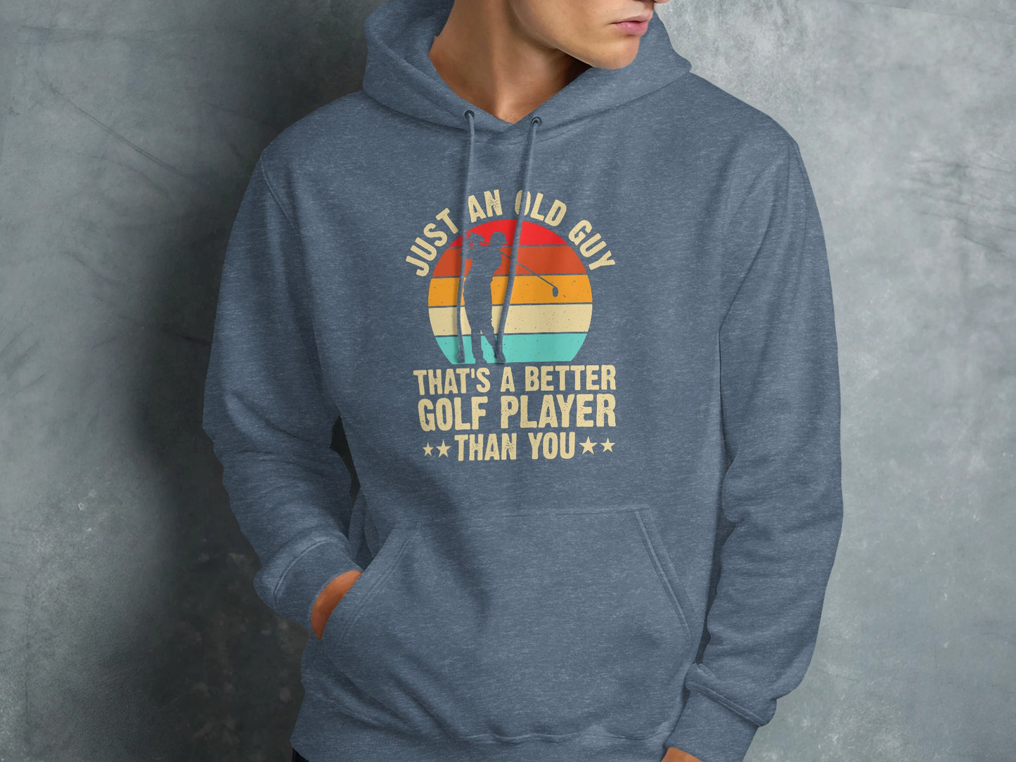 Blue hoodie with "Just an old guy that's a better golf player than you" text.