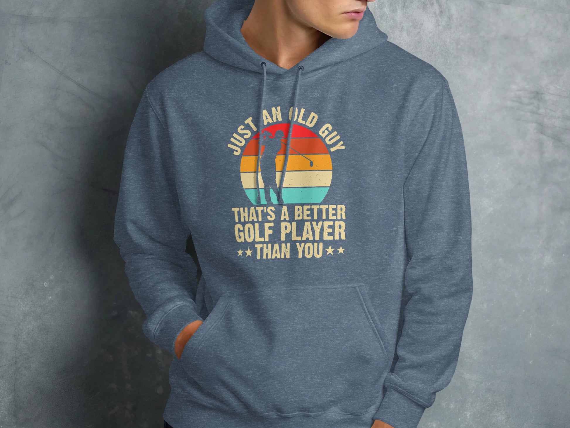 Blue hoodie with "Just an old guy that's a better golf player than you" text.
