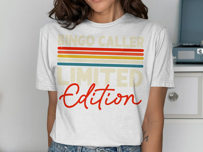 White t-shirt with "Bingo Caller Limited Edition" in colorful retro stripes.