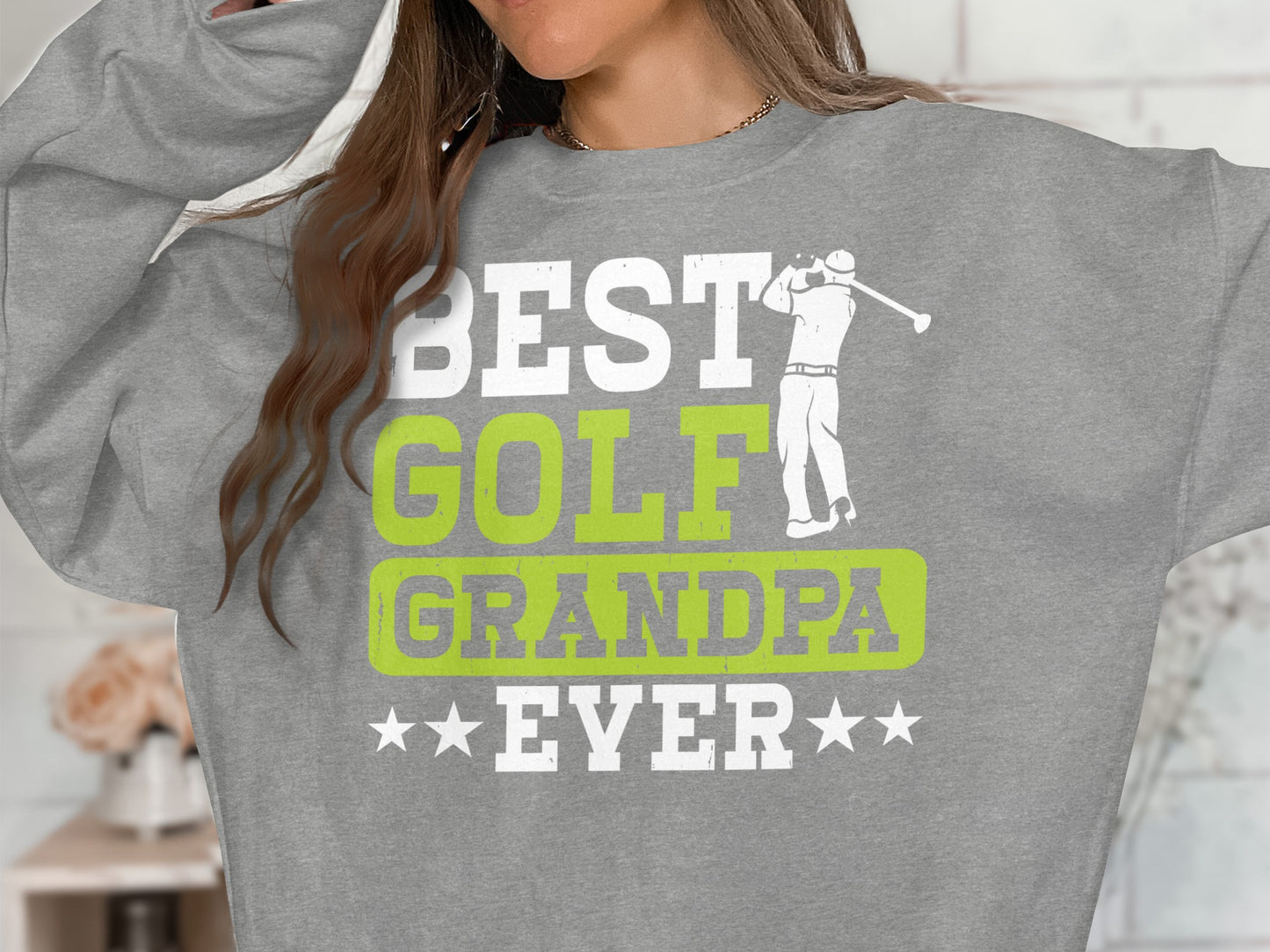Grey sweatshirt with "BEST GOLF GRANDPA EVER" text and golf graphic.