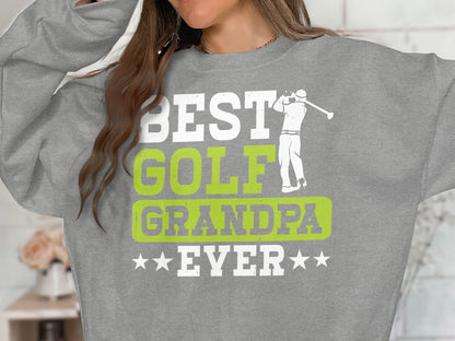 Grey sweatshirt with "BEST GOLF GRANDPA EVER" text and golf graphic.