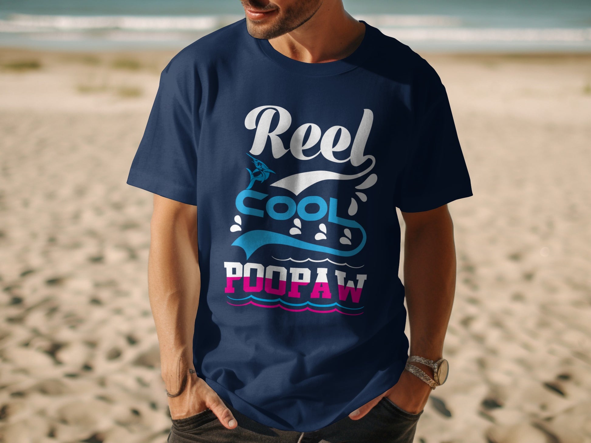 Navy t-shirt with "Reel Cool Poopaw" text and ocean wave graphics.