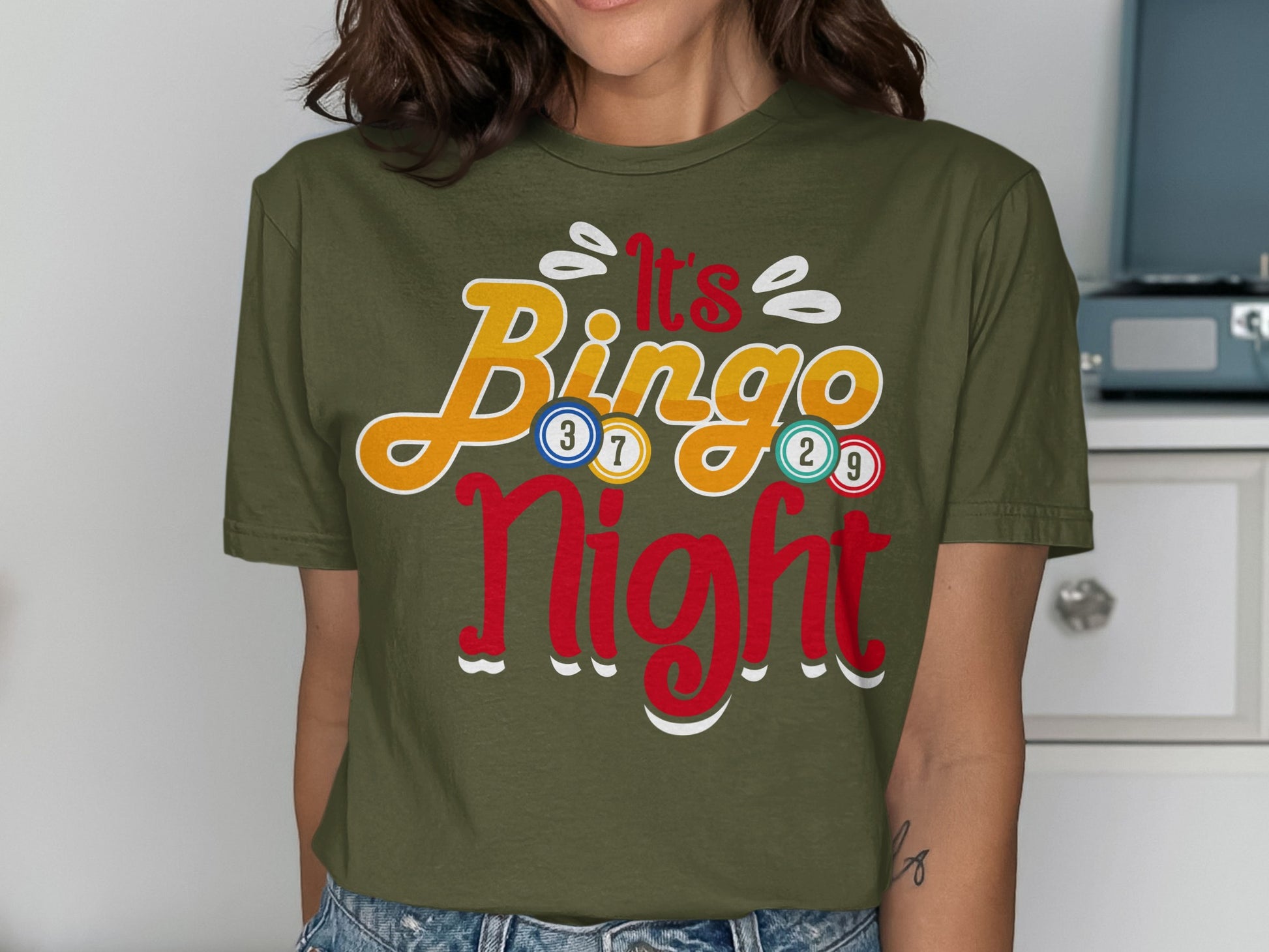 Green t-shirt with "It's Bingo Night" text and colorful bingo balls.