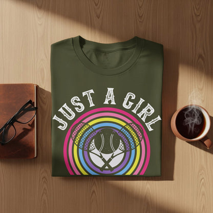 Olive green t-shirt with "Just a Girl" text and tennis rackets graphic.