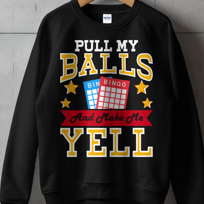 Black sweatshirt with "PULL MY BALLS And Make Me YELL" and bingo cards.