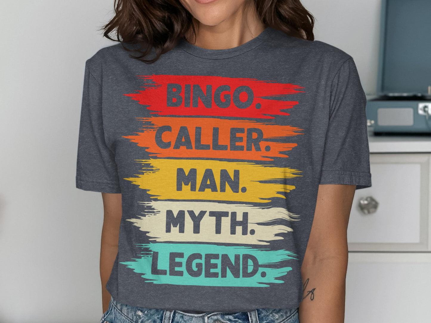 Charcoal t-shirt with "Bingo. Caller. Man. Myth. Legend." text in colorful brushstrokes.