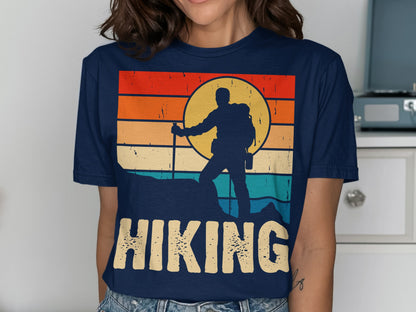 Retro sunset graphic with hiker silhouette and "HIKING" text on a navy t-shirt.