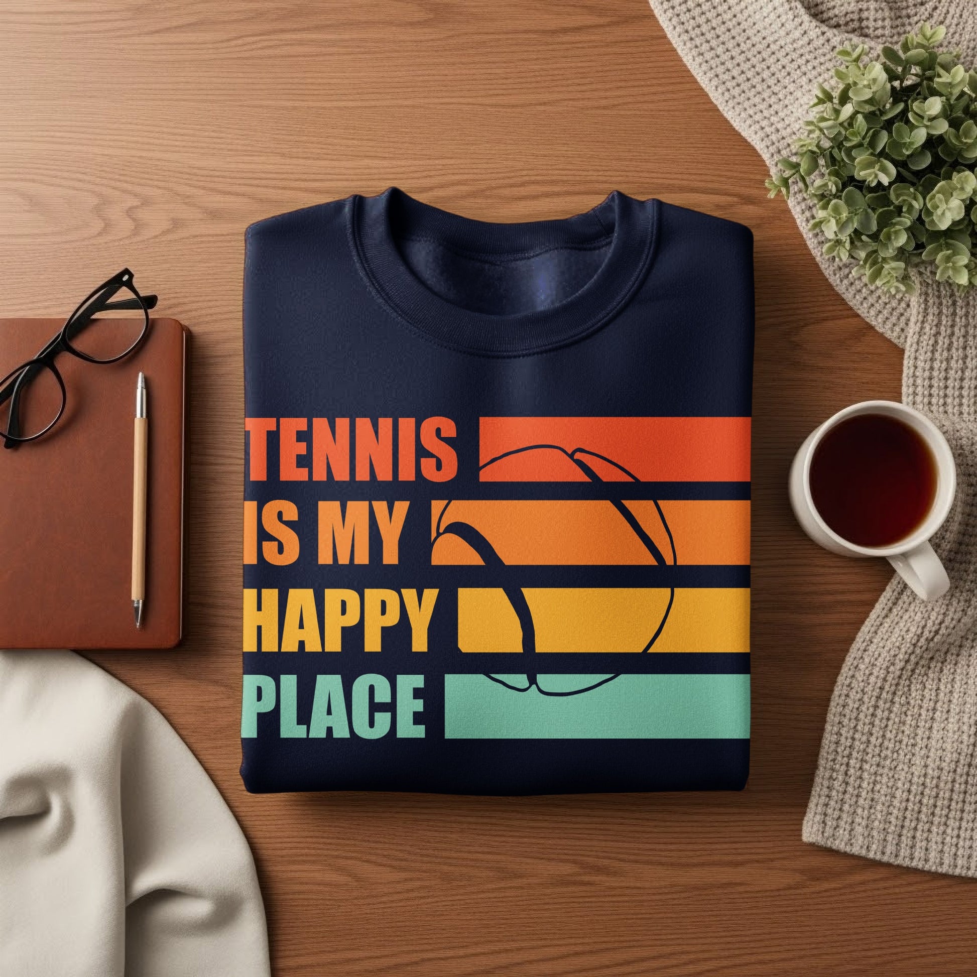 Navy sweatshirt with "Tennis is my happy place" and a colorful tennis ball graphic.