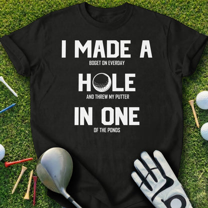 Black t-shirt with text I MADE A HOLE IN ONE OF THE PONDS.