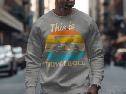Grey sweatshirt with a vintage sunset graphic and "This is HOW I ROLL" text.