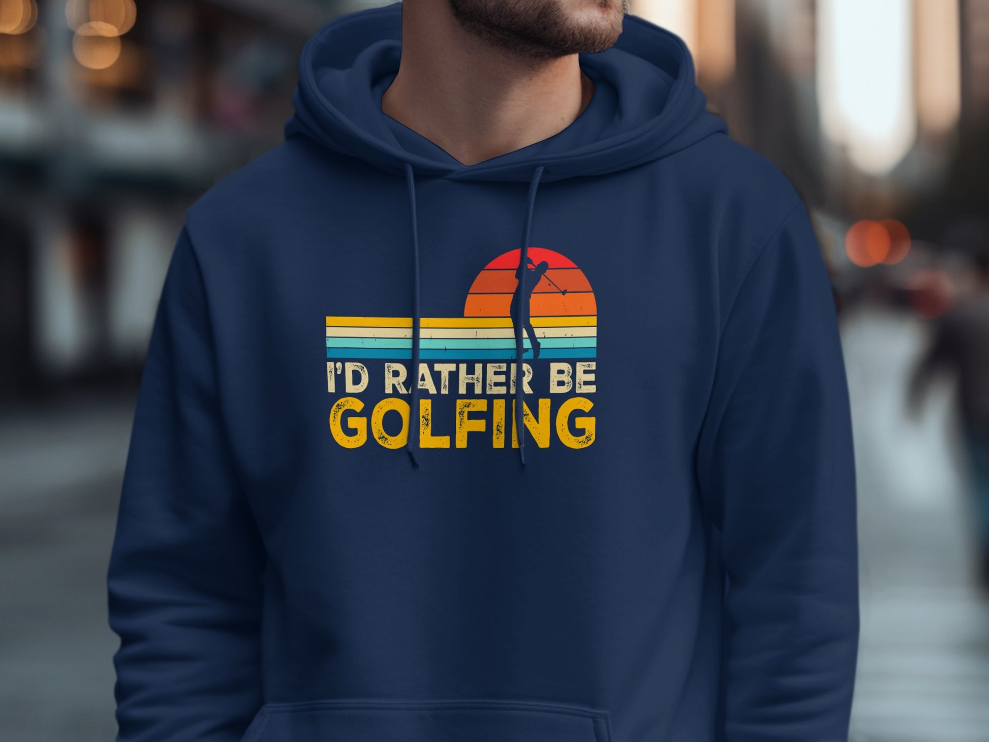 Navy hoodie with "I'd rather be golfing" text and sunset golf silhouette graphic.