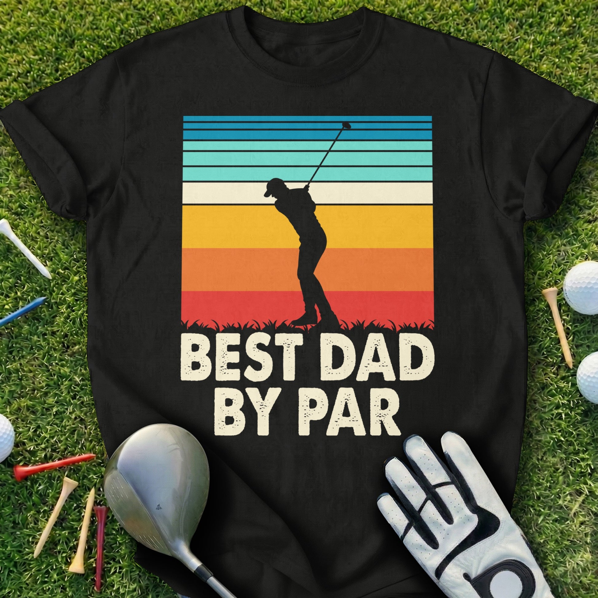 Black t-shirt with "BEST DAD BY PAR" text and a golfer silhouette against a sunset.