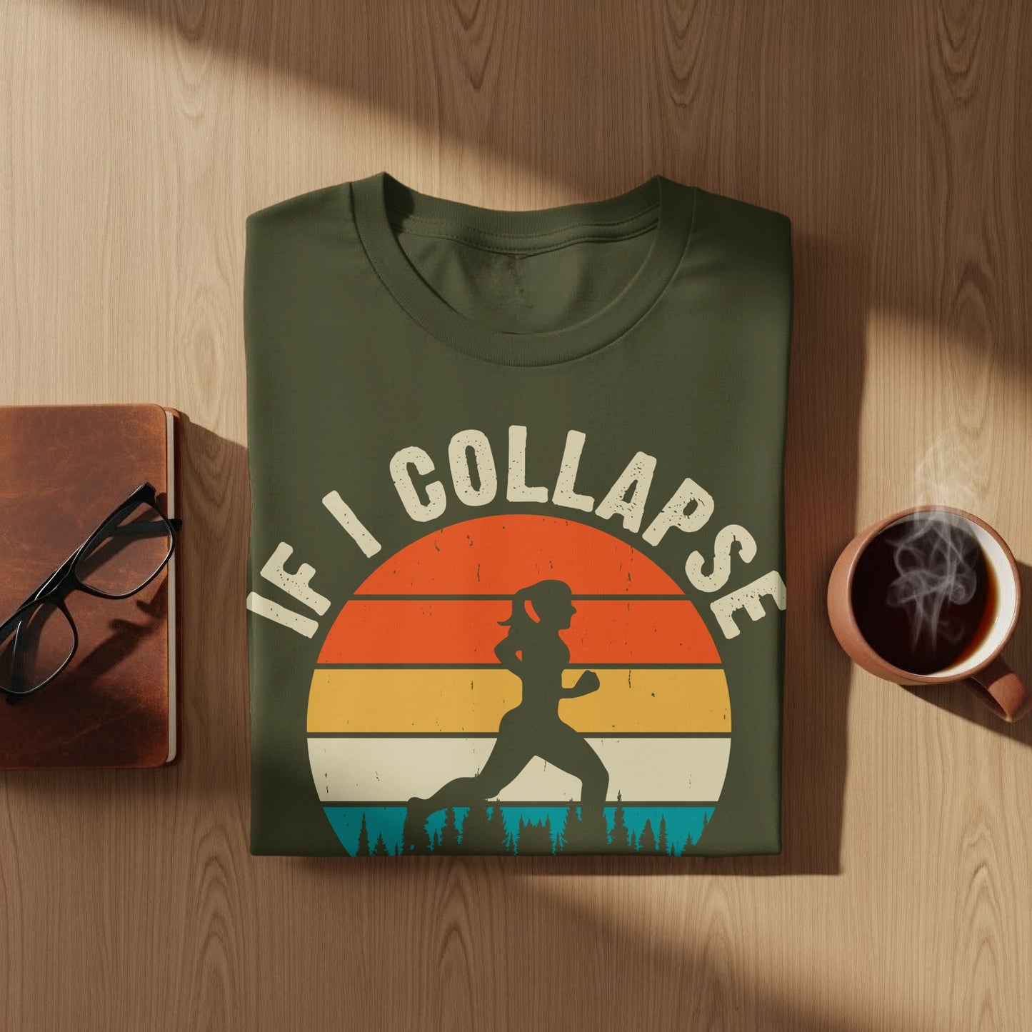 Olive green t-shirt with runner silhouette against colorful sunset graphic.