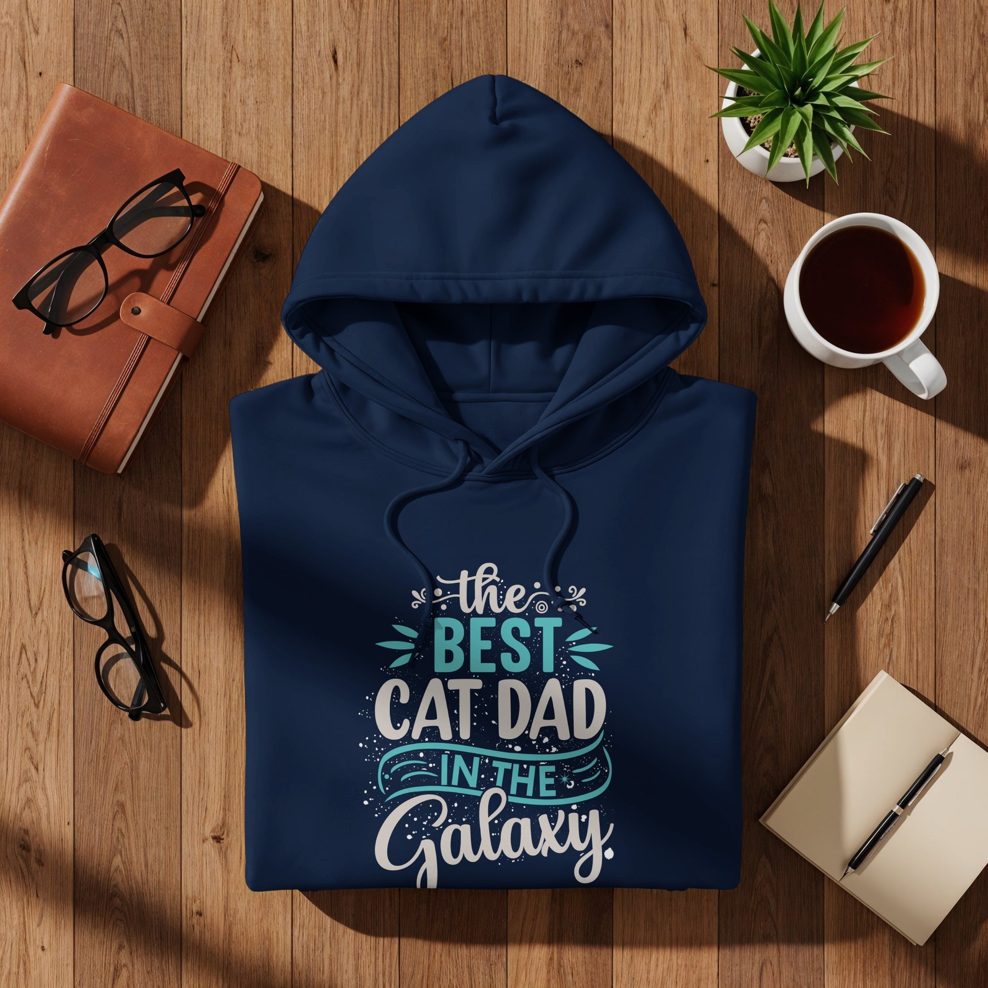 Navy hoodie with "The Best Cat Dad In The Galaxy" text design.