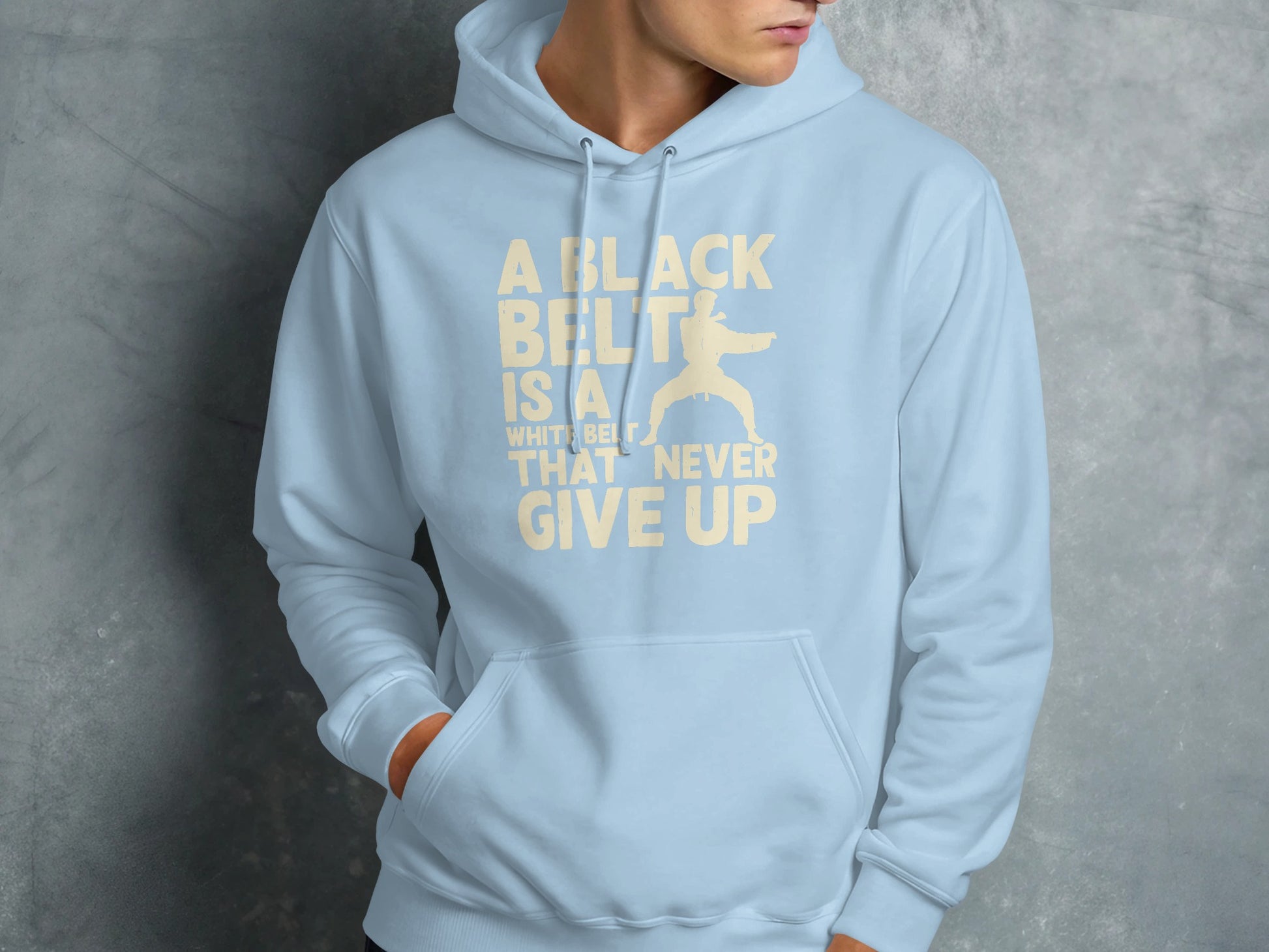 Light blue hoodie with white text and karate silhouette.