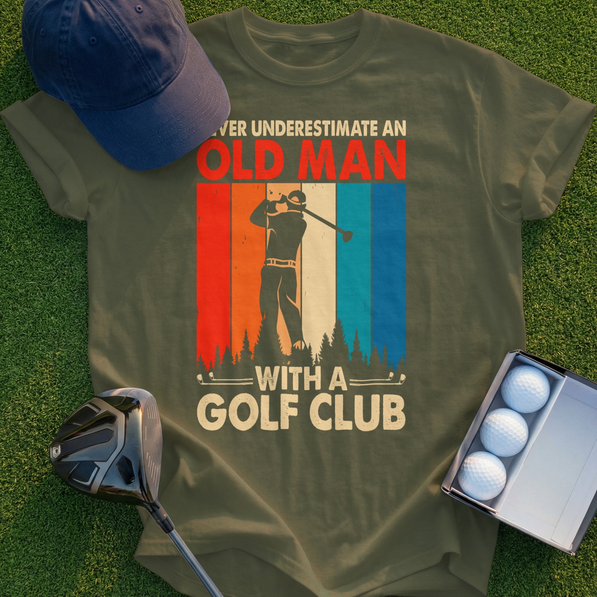 Olive green t-shirt with "Never Underestimate an Old Man with a Golf Club" text.