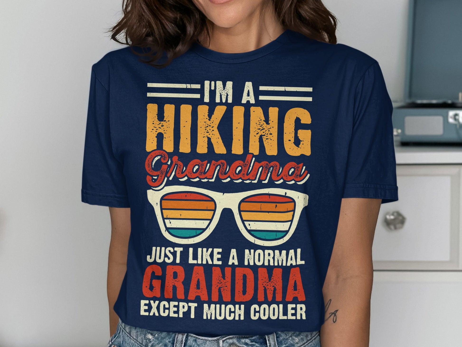 T-shirt with "I'm a hiking grandma, just like a normal grandma except much cooler" text.