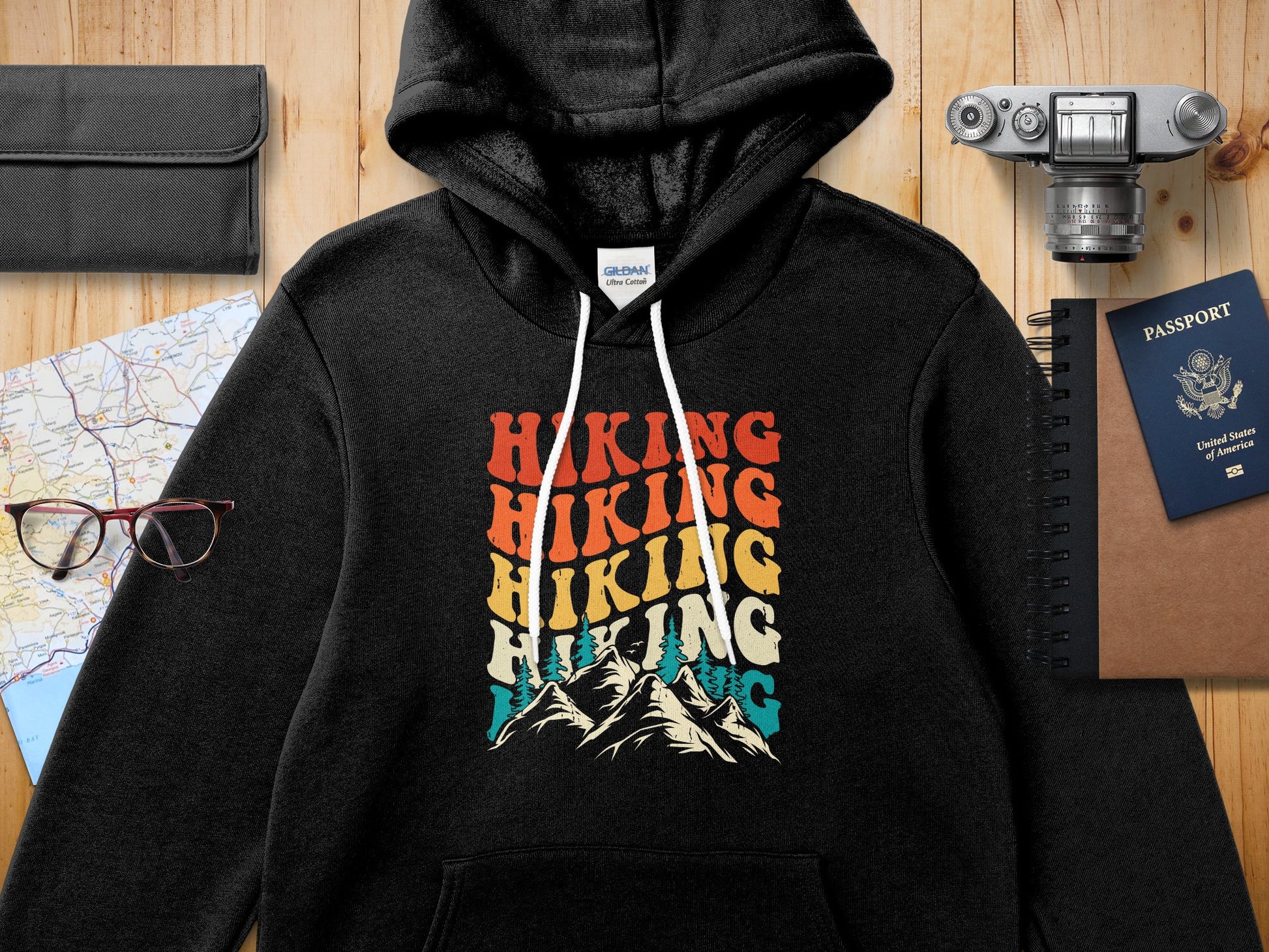 Black hoodie with "Hiking Hiking Hiking" text and mountain graphic.