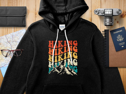 Black hoodie with "Hiking Hiking Hiking" text and mountain graphic.
