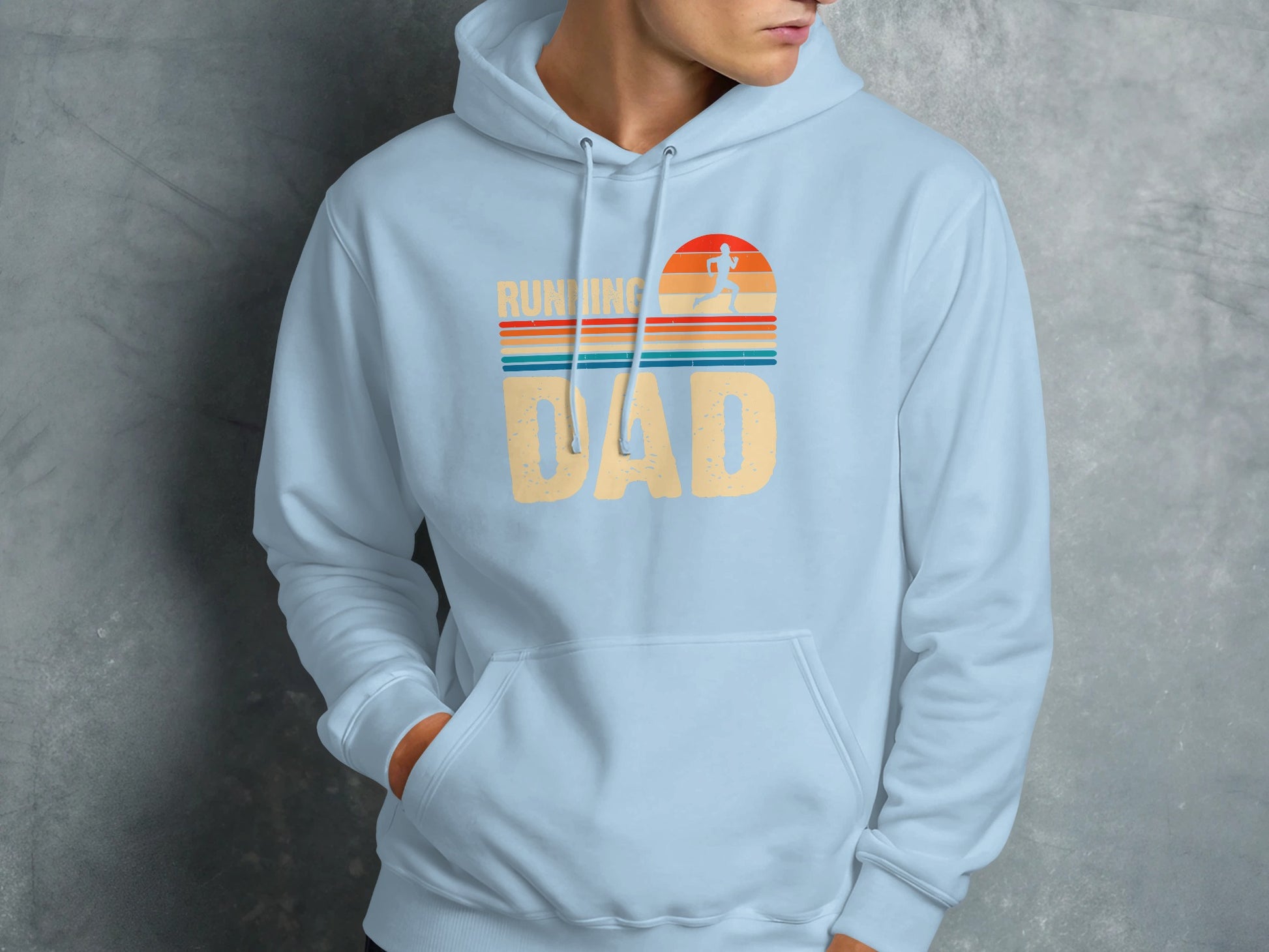 Light blue hoodie with "RUNNING DAD" text and sunset graphic.