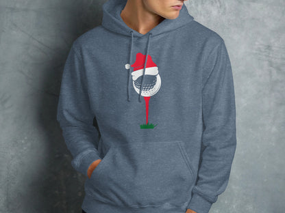 Golf ball wearing Santa hat on tee, printed on blue hoodie.