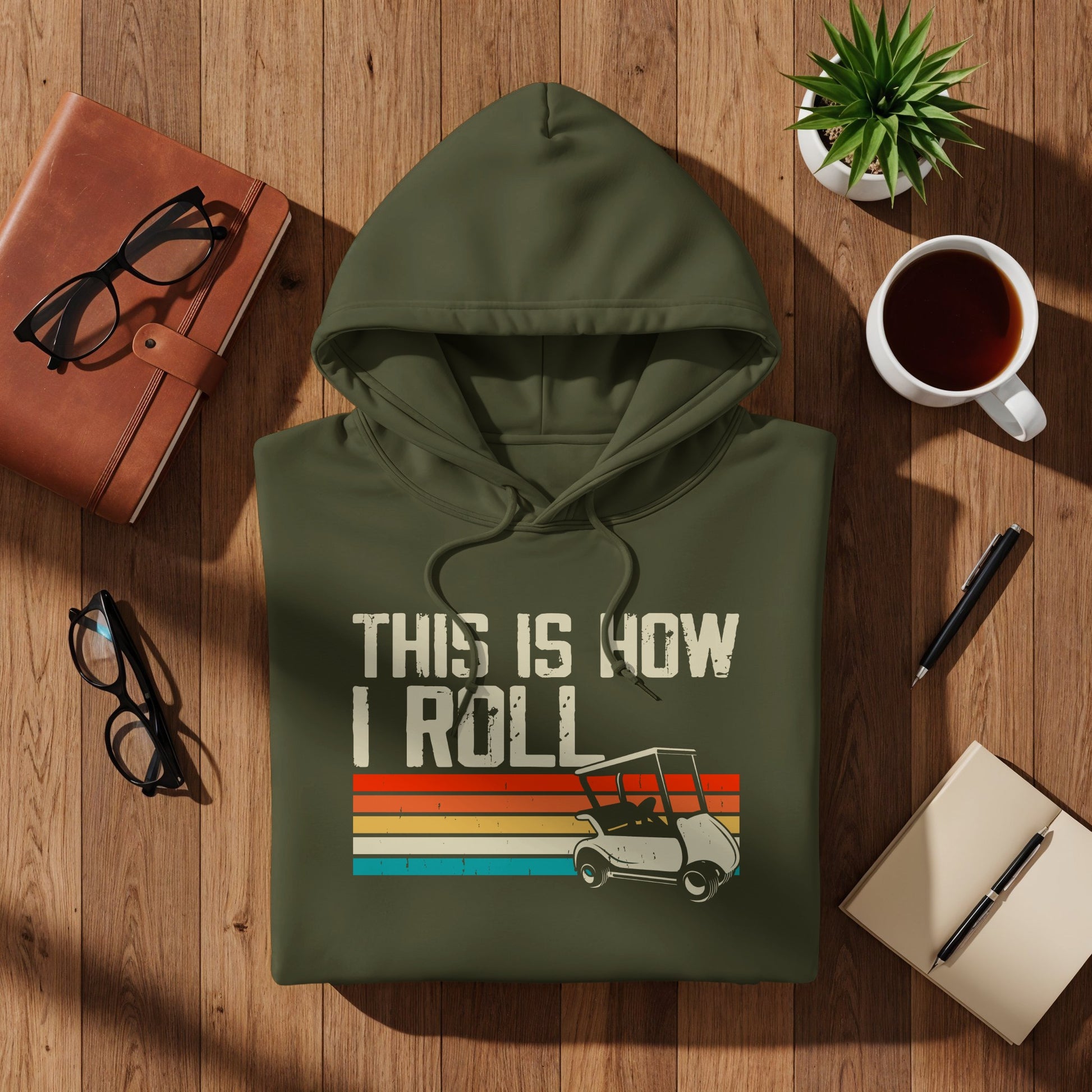 Green hoodie with "THIS IS HOW I ROLL" text and a golf cart graphic.
