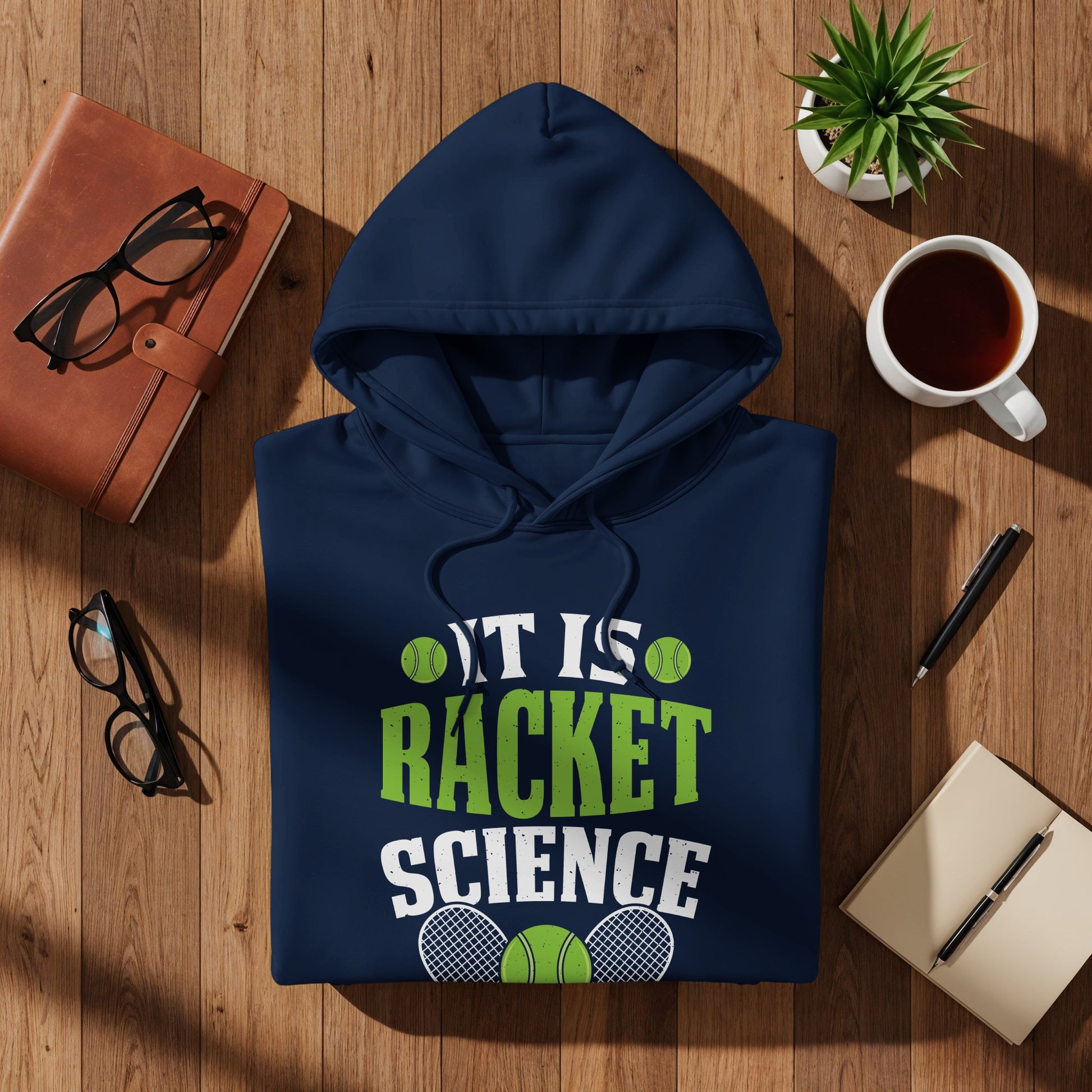 Navy hoodie with "IT IS RACKET SCIENCE" text, tennis balls, and racquets.