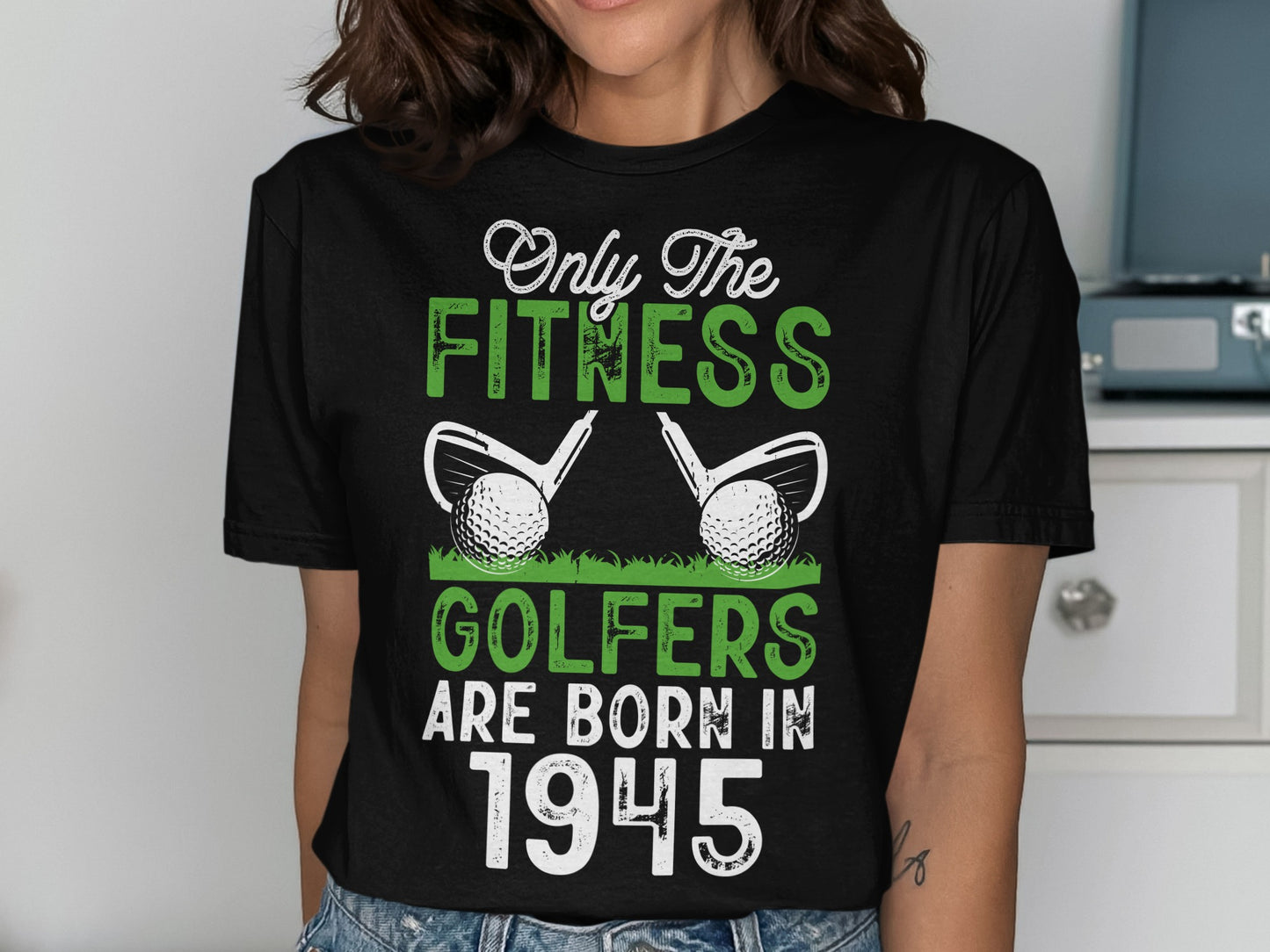Black t-shirt with white text: "Only the fitness golfers are born in 1945".