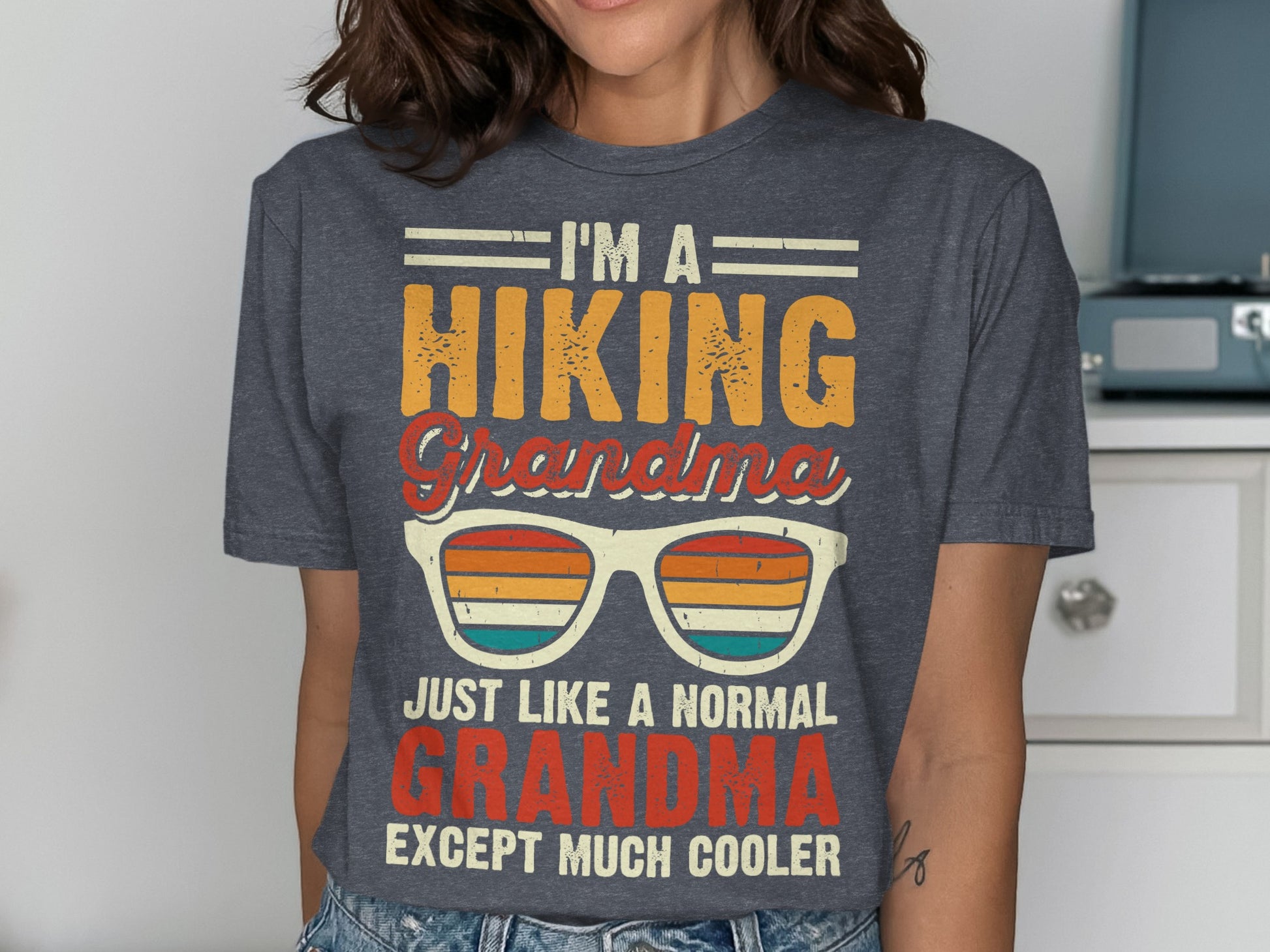 T-shirt with "I'm a hiking grandma, just like a normal grandma except much cooler" text and sunglasses graphic.