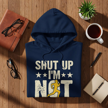 Navy hoodie with "Shut Up I'm Not" text and a running figure.