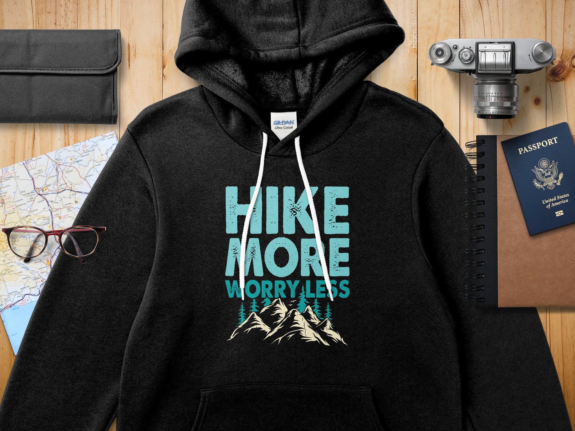 Black hoodie with "Hike More Worry Less" graphic and mountain illustration.