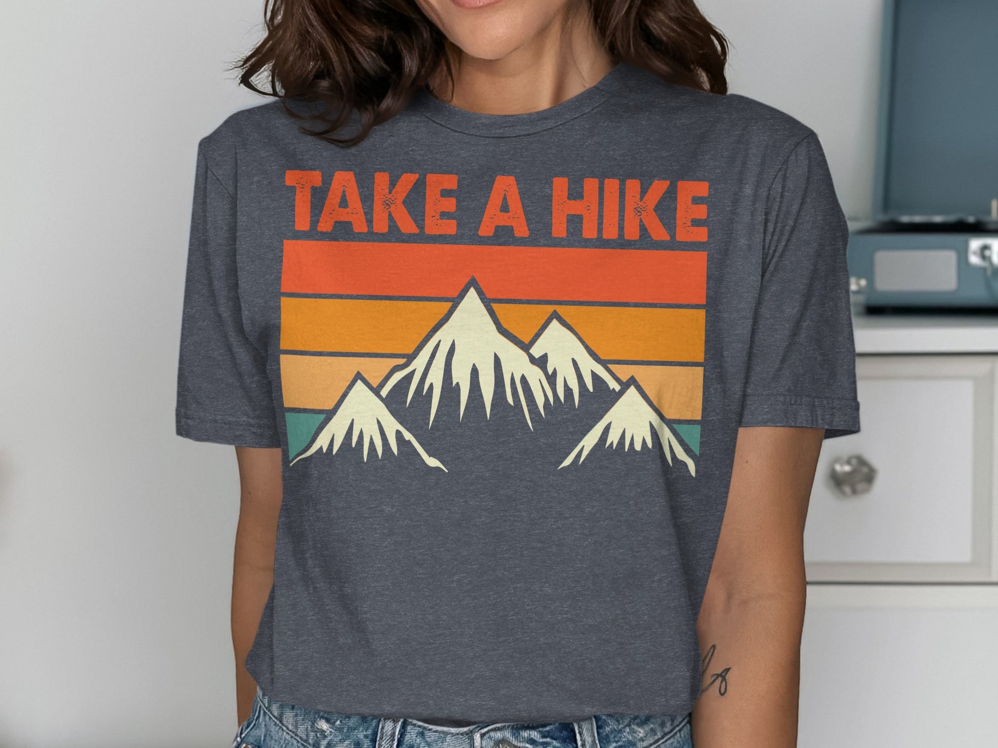 Dark gray t-shirt with "TAKE A HIKE" and mountain graphic.