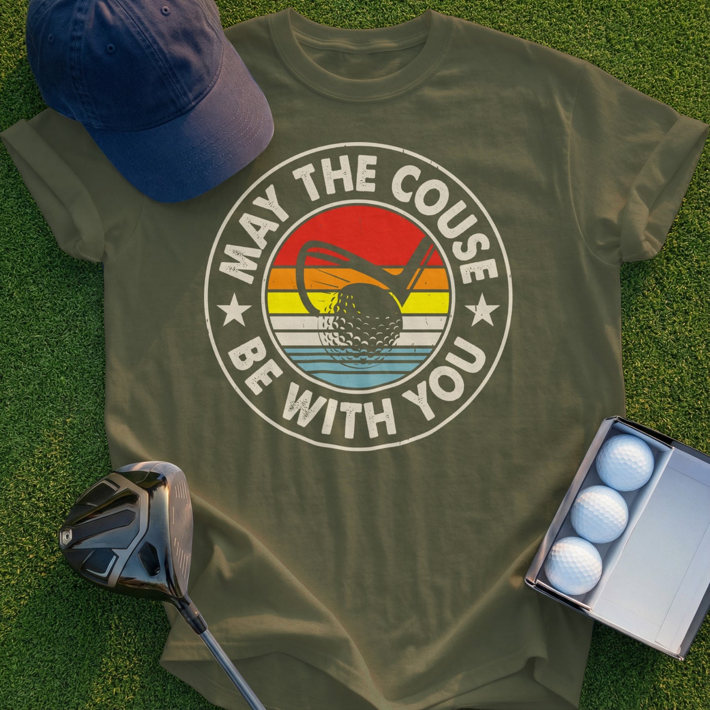 Olive t-shirt with "May the Couse Be With You" golf graphic and golf balls.