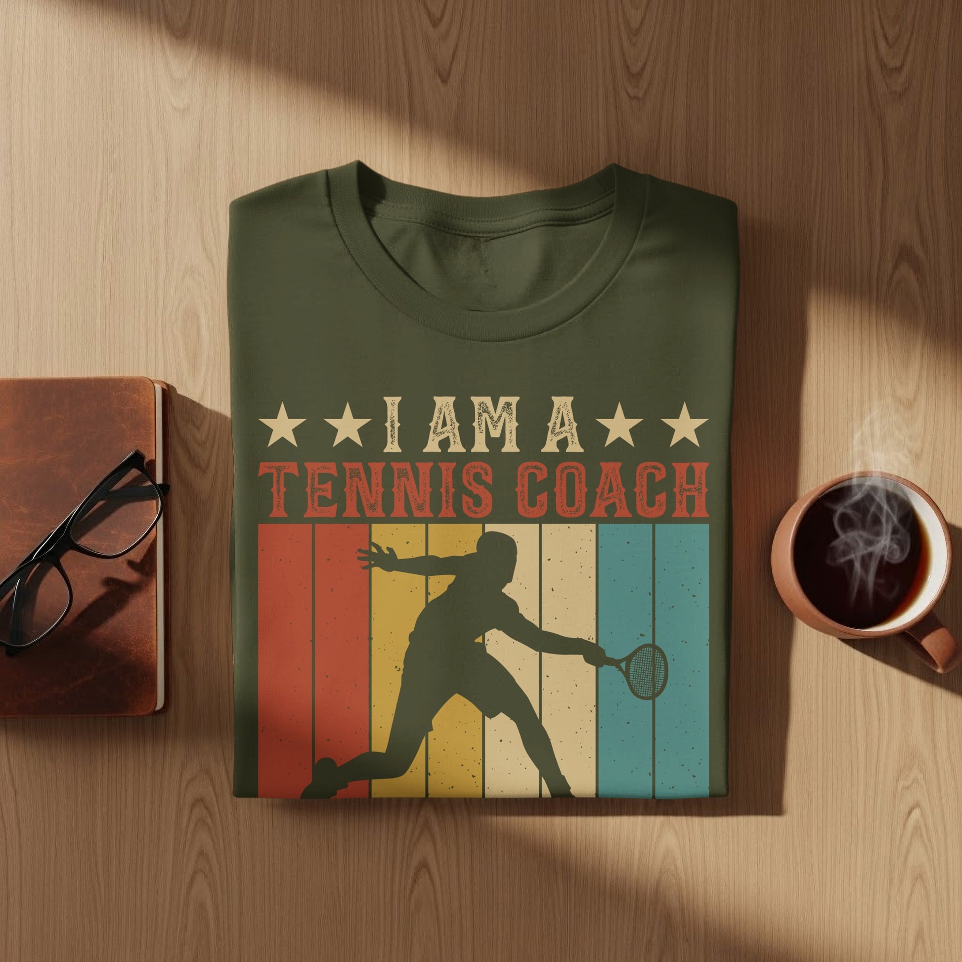 T-shirt with silhouette of tennis player and text "I AM A TENNIS COACH".