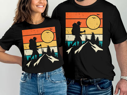 Retro sunset hiker silhouette on a black t-shirt with mountains and trees.