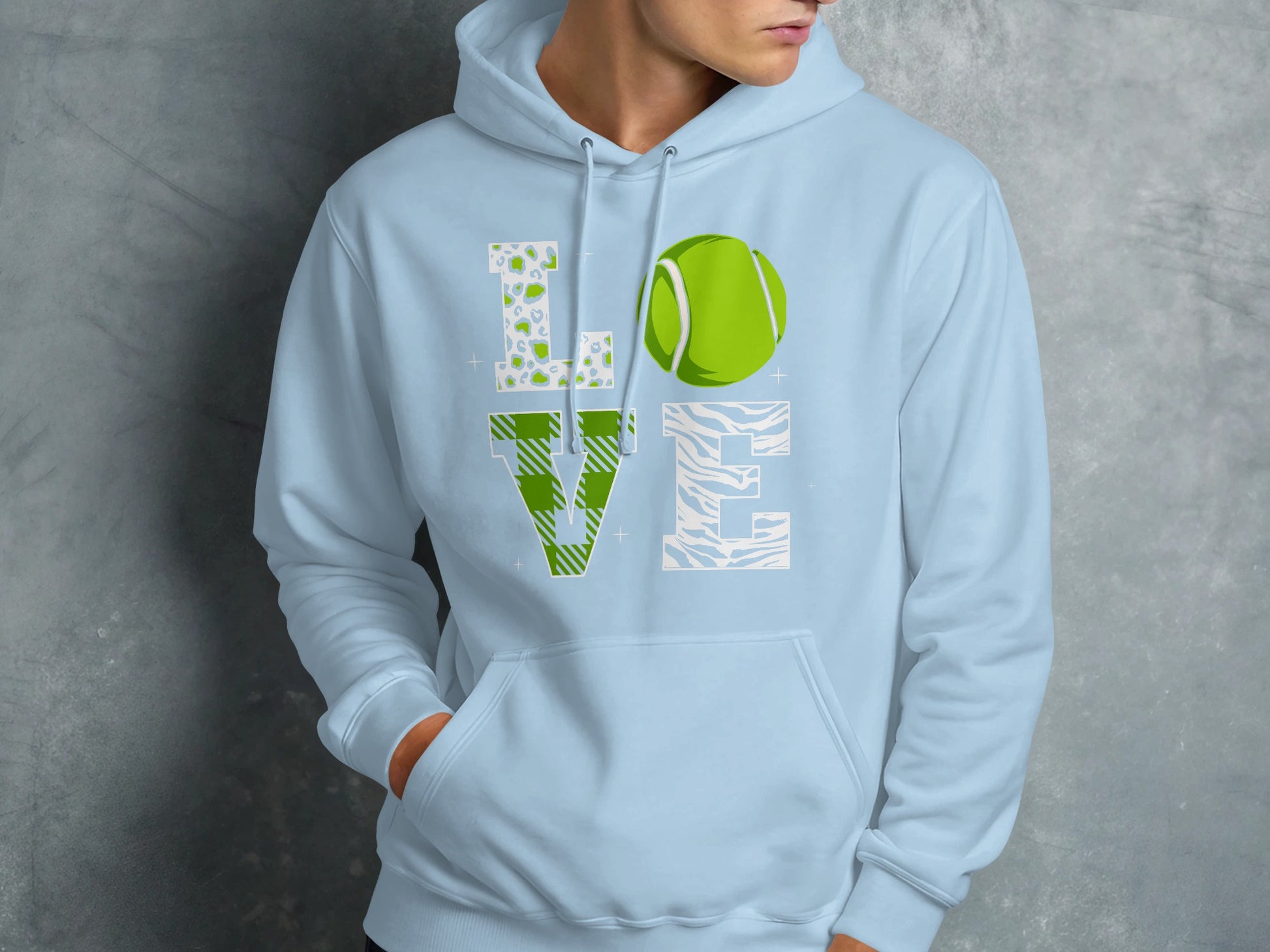 Light blue hoodie with "LOVE" graphic featuring a tennis ball and animal prints.