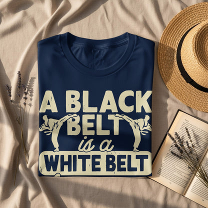 Navy t-shirt with "A BLACK BELT is a WHITE BELT" graphic.