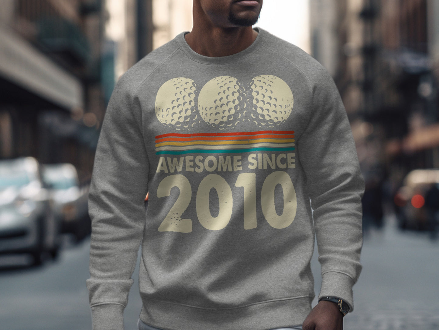 Gray sweatshirt with "Awesome Since 2010" and three golf balls.