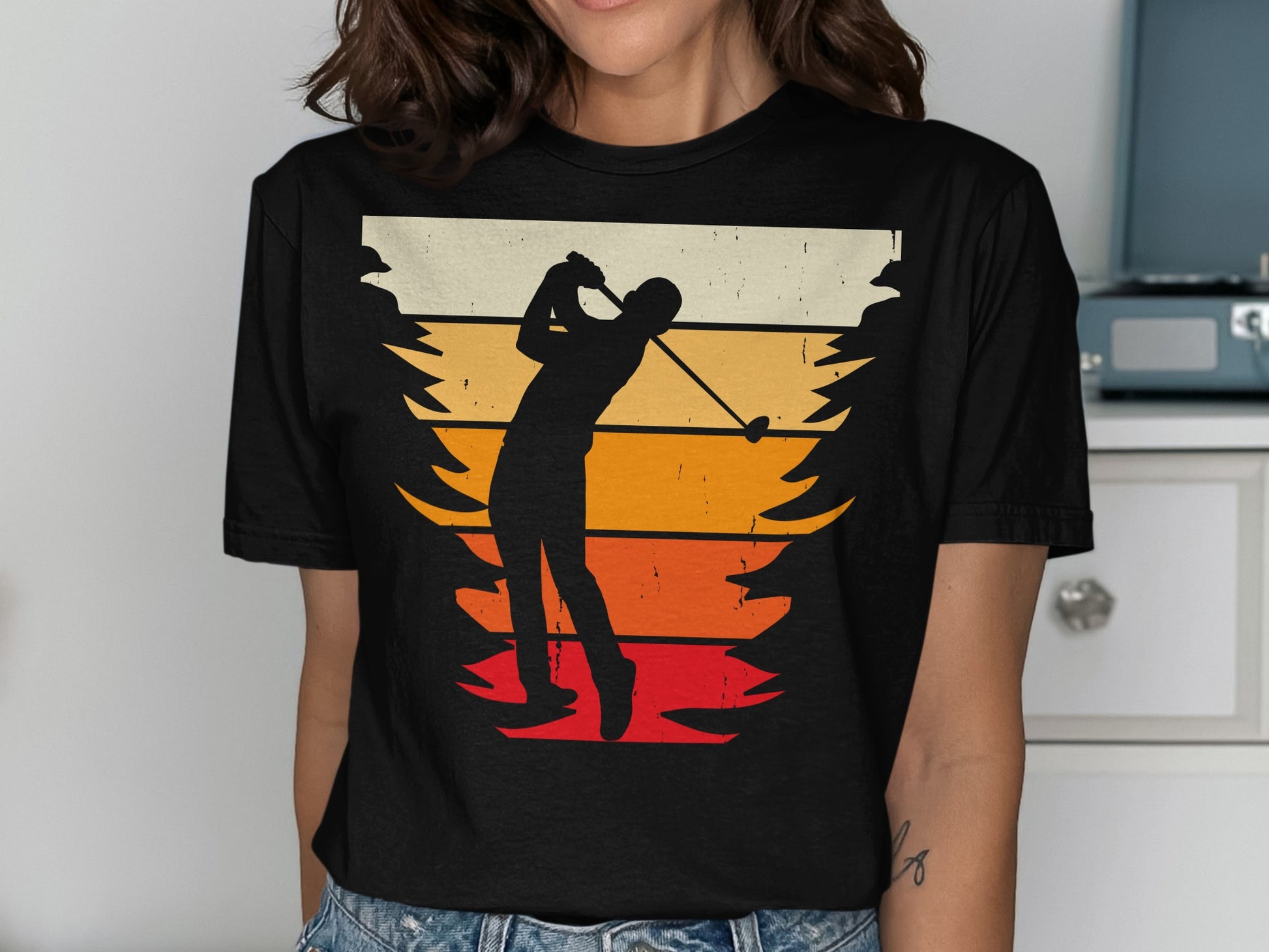 Silhouette of a golfer swinging at sunset, framed by trees.