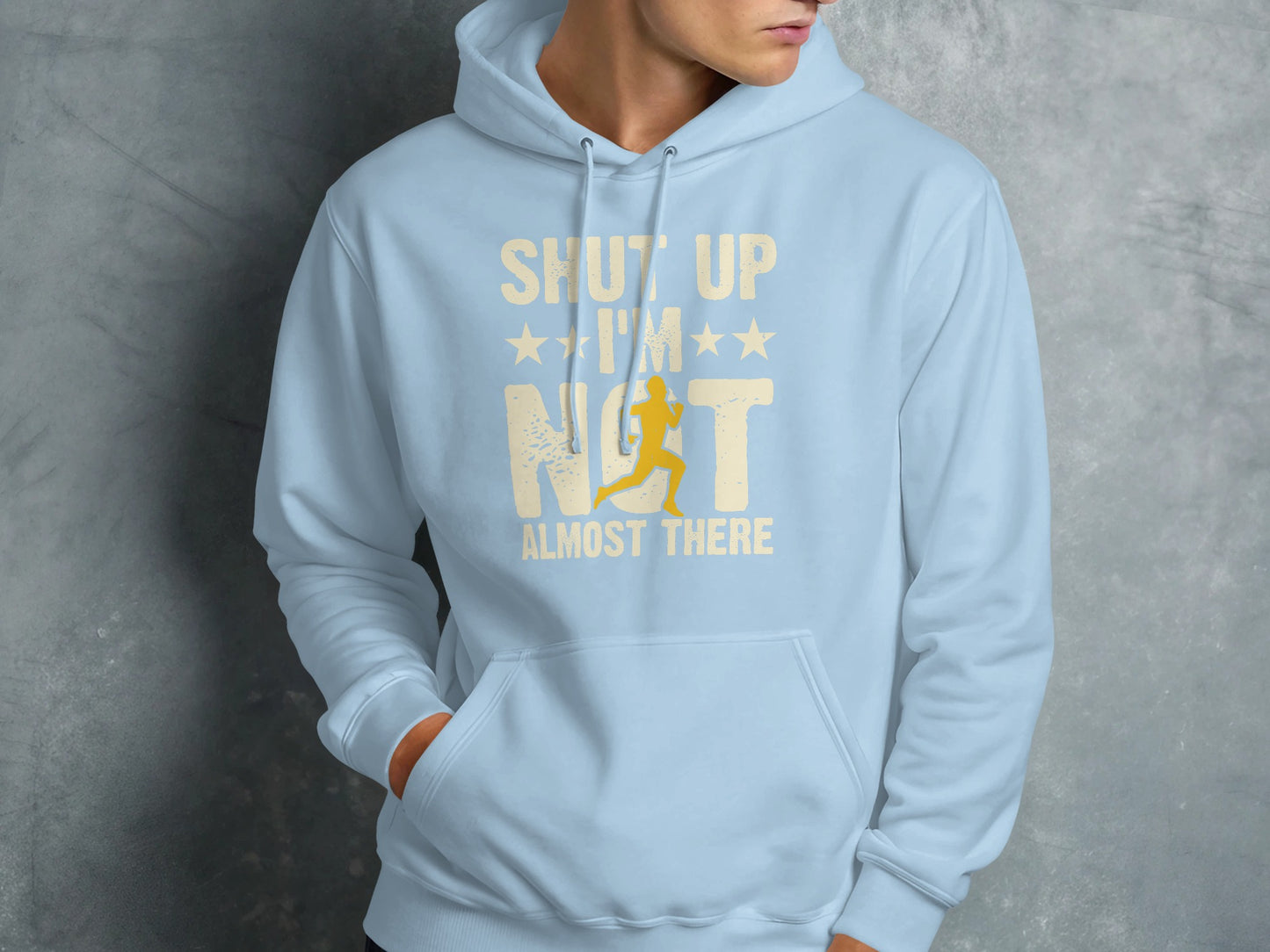 Light blue hoodie with "Shut Up I'm Not Almost There" text and runner graphic.