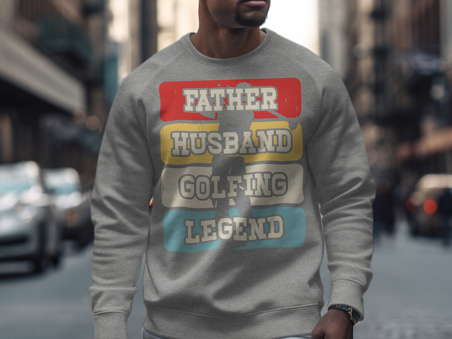 Grey sweatshirt with "FATHER HUSBAND GOLFING LEGEND" text in colorful blocks.