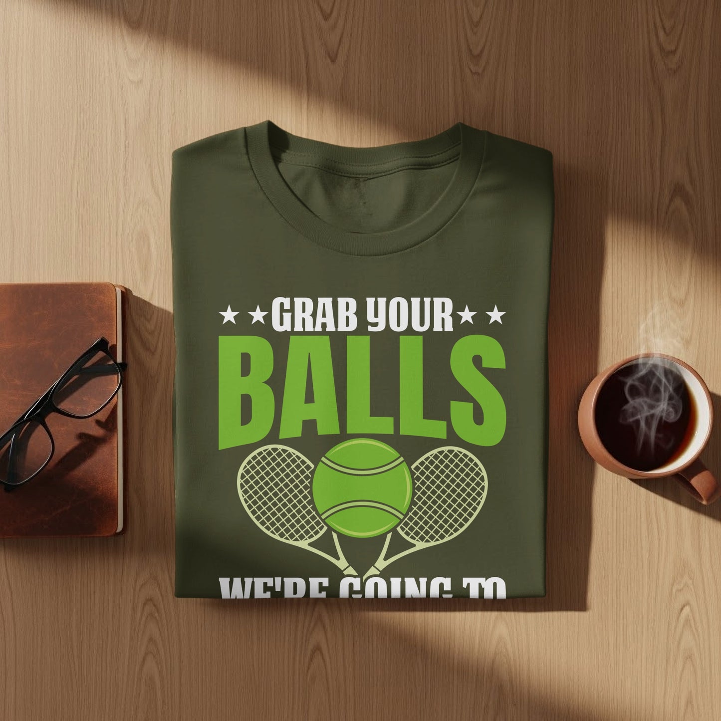 Green t-shirt with "Grab your balls" and tennis ball graphic.