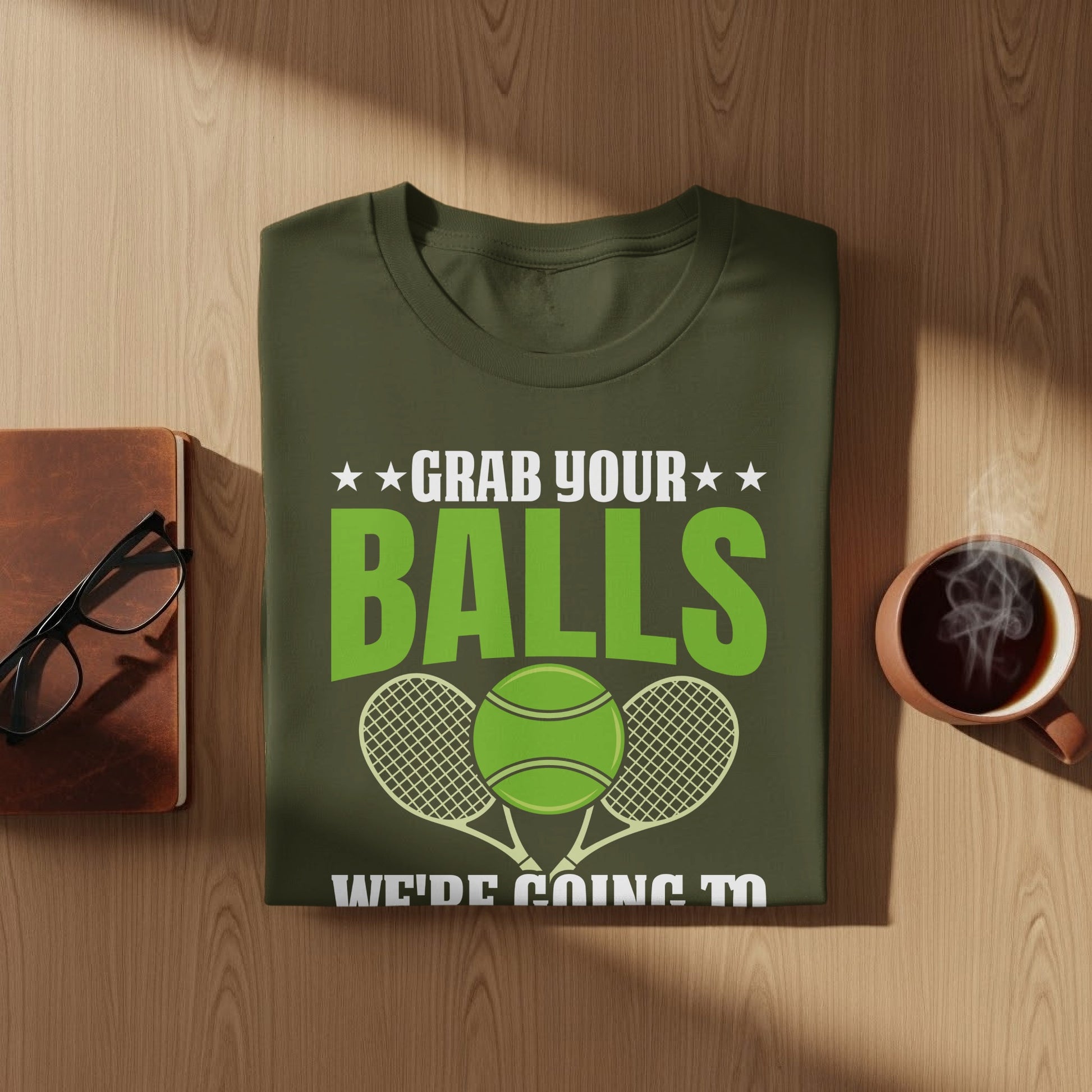 Green t-shirt with "Grab your balls" and tennis ball graphic.