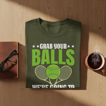 Green t-shirt with "Grab your balls" and tennis ball graphic.