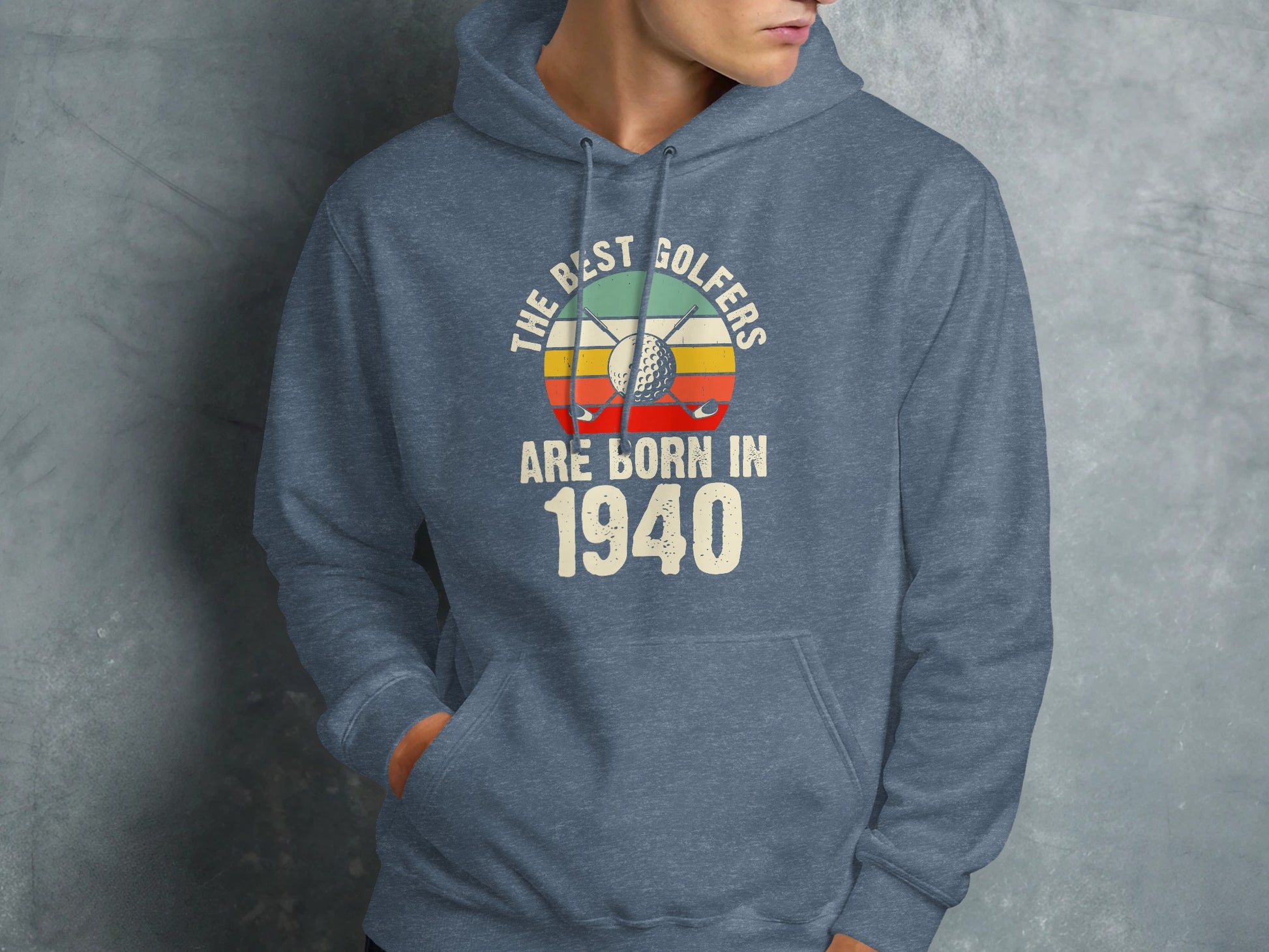 Blue hoodie with "The Best Golfers Are Born In 1940" text and golf imagery.