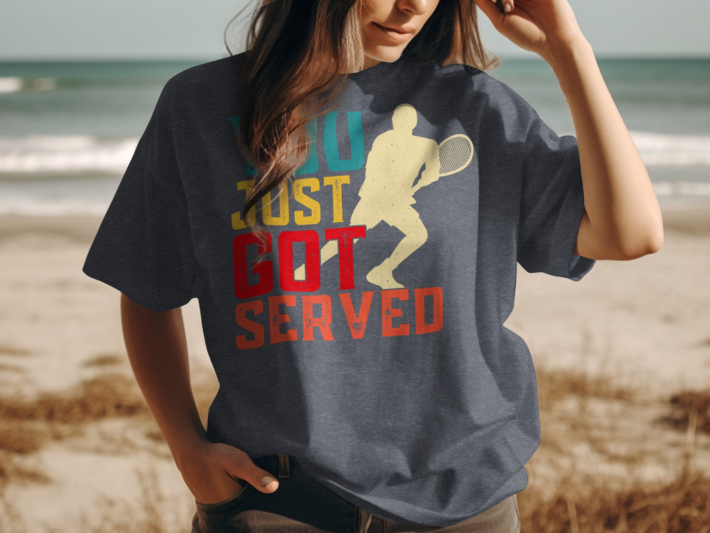 Dark t-shirt with vintage graphic of tennis player and text "YOU JUST GOT SERVED".
