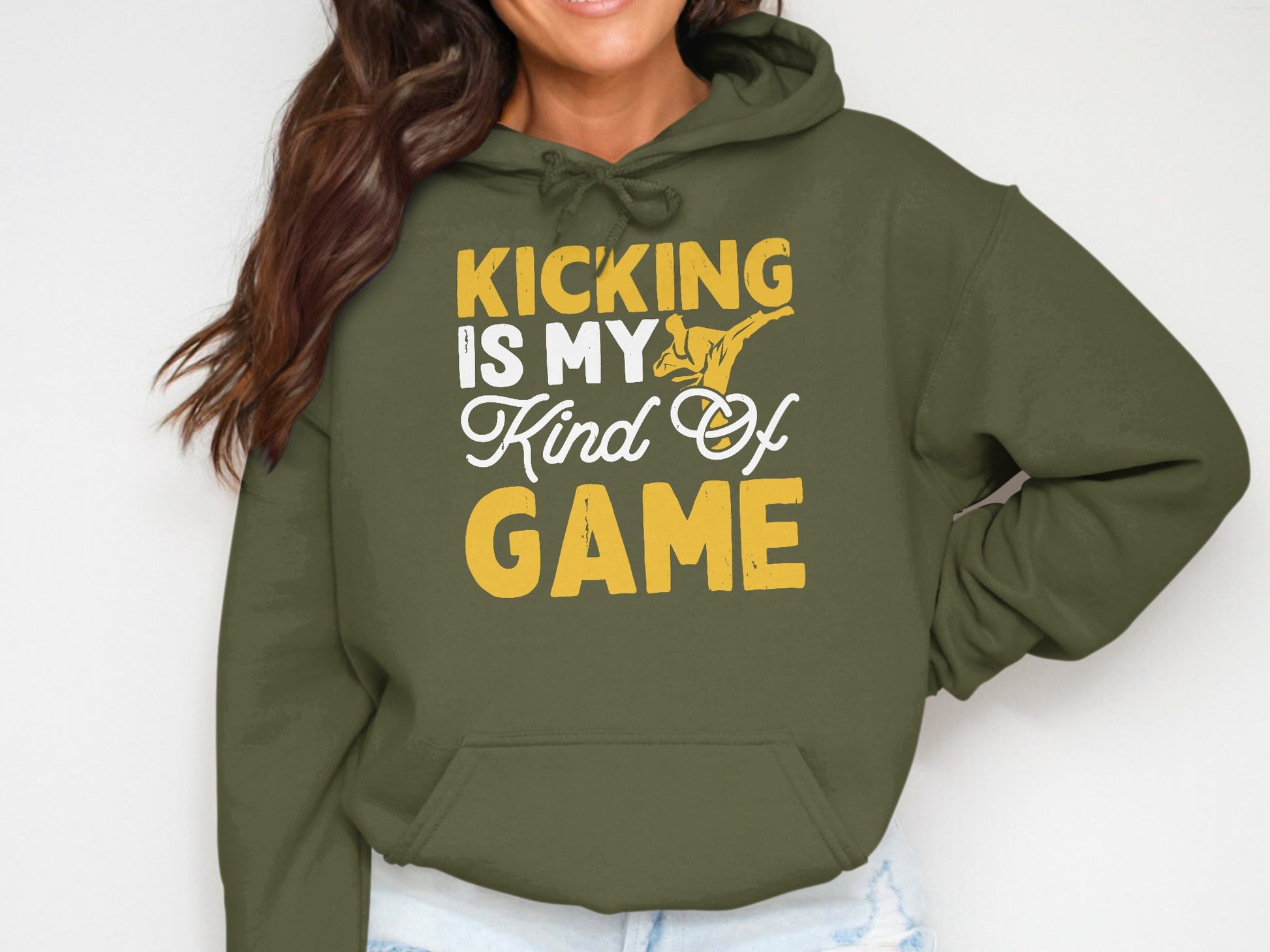 Olive green hoodie with "Kicking is my kind of game" text and martial arts graphic.