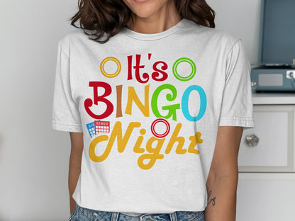 White t-shirt with colorful "It's BINGO Night" text and bingo balls.