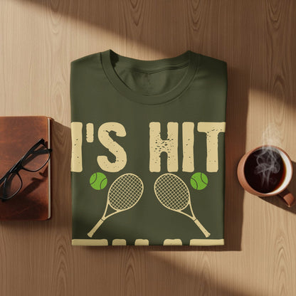 T-shirt with text "I'S HIT" and tennis rackets and balls.