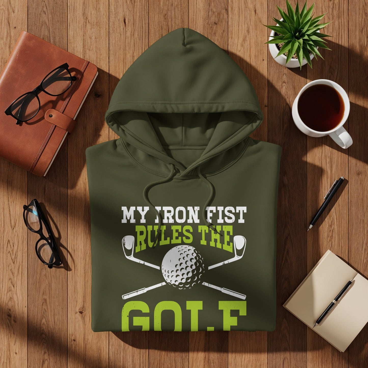 Green hoodie with "My Iron Fist Rules The Golf" text and golf ball graphic.